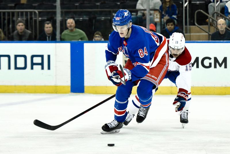 Nov 30, 2024; New York, New York, USA; New York Rangers center Adam Edstrom (84) skates with the puck against Montreal Canadiens center Alex Newhook (15) during the first period at Madison Square Garden. Mandatory Credit: John Jones-Imagn Images