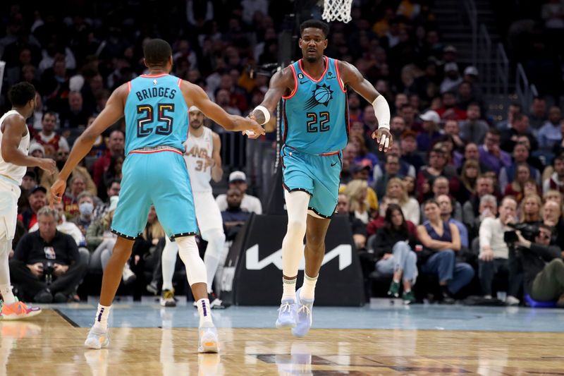 CLEVELAND, OH - JANUARY 4: Mikal Bridges #25 and Deandre Ayton #22 of the Phoenix Suns high fives during the game against the Cleveland Cavaliers on January 4, 2023 at Rocket Mortgage FieldHouse in Cleveland, Ohio. NOTE TO USER: User expressly acknowledges and agrees that, by downloading and/or using this Photograph, user is consenting to the terms and conditions of the Getty Images License Agreement. Mandatory Copyright Notice: Copyright 2022 NBAE (Photo by  Lauren Bacho/NBAE via Getty Images)