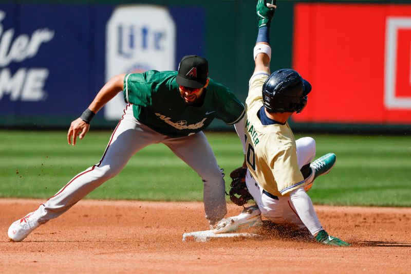 Jul 8, 2023; Seattle, Washington, USA; American League Futures shortstop Marcelo Mayer (10) of the Bost Red Sox steals second base against National League Futures shortstop Jordan Lawlar (11) of the Arizona Diamondbacks during the first inning at T-Mobile Park. Mandatory Credit: Joe Nicholson-USA TODAY Sports