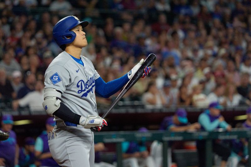 Sep 25, 2025; Phoenix, Arizona, USA; Los Angeles Dodgers designated hitter Shohei Ohtani (17) reacts after striking out in the second inning against the Arizona Diamondbacks at Chase Field. Mandatory Credit: Allan Henry-Imagn Images