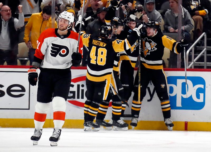 Feb 25, 2024; Pittsburgh, Pennsylvania, USA;  Th Pittsburgh Penguins celebrate a goal by Penguins left wing Drew O'Connor (right) against the Philadelphia Flyers during the third period at PPG Paints Arena.  Pittsburgh won 7-6. Mandatory Credit: Charles LeClaire-USA TODAY Sports