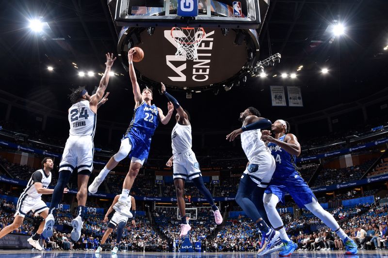 ORLANDO, FL - MARCH 30: Franz Wagner #22 of the Orlando Magic drives to the basket during the game against the Memphis Grizzlies on March 30, 2024 at the Kia Center in Orlando, Florida. NOTE TO USER: User expressly acknowledges and agrees that, by downloading and or using this photograph, User is consenting to the terms and conditions of the Getty Images License Agreement. Mandatory Copyright Notice: Copyright 2024 NBAE (Photo by Fernando Medina/NBAE via Getty Images)