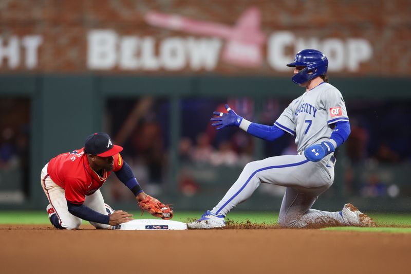 Sep 27, 2024; Atlanta, Georgia, USA; Atlanta Braves second baseman Ozzie Albies (1) forces out Kansas City Royals shortstop Bobby Witt Jr. (7) in the fourth inning at Truist Park. Mandatory Credit: Brett Davis-Imagn Images
