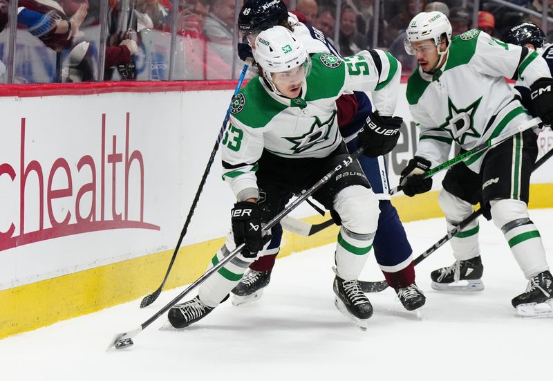 Feb 27, 2024; Denver, Colorado, USA; Colorado Avalanche defenseman Samuel Girard (49) and Dallas Stars center Wyatt Johnston (53) during the first period at Ball Arena. Mandatory Credit: Ron Chenoy-USA TODAY Sports