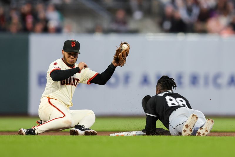 Aug 19, 2024; San Francisco, California, USA; Chicago White Sox outfielder Luis Robert Jr. (88) steals second base during the fifth inning against the San Francisco Giants at Oracle Park. Mandatory Credit: Sergio Estrada-USA TODAY Sports