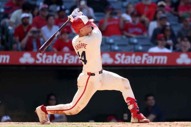 Jun 9, 2024; Anaheim, California, USA;  Los Angeles Angels catcher Logan O'Hoppe (14) hits a game winning 2-run home run in bottom of the ninth inning against the Houston Astros at Angel Stadium. Mandatory Credit: Kiyoshi Mio-USA TODAY Sports