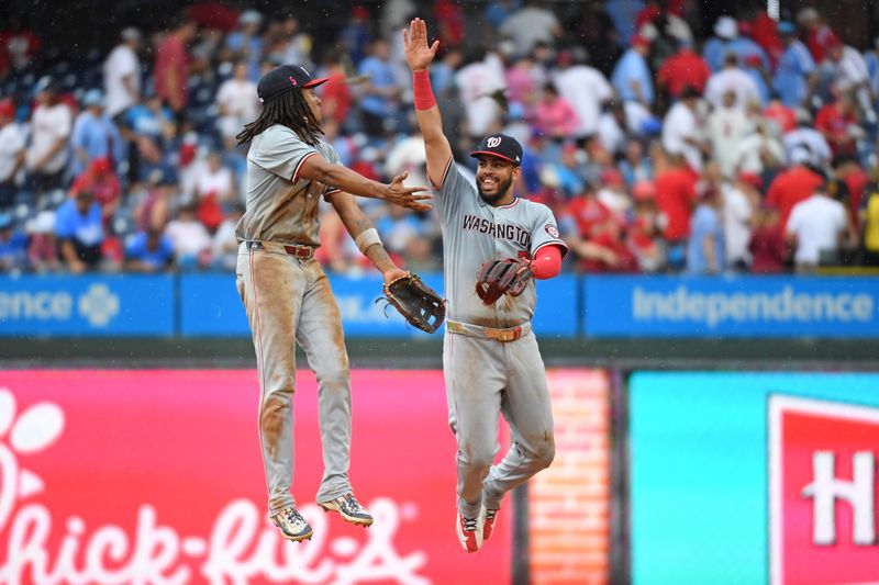 Aug 18, 2024; Philadelphia, Pennsylvania, USA; Washington Nationals shortstop CJ Abrams (5) and second base Luis García Jr. (2) celebrate win against the Philadelphia Phillies at Citizens Bank Park. Mandatory Credit: Eric Hartline-USA TODAY Sports