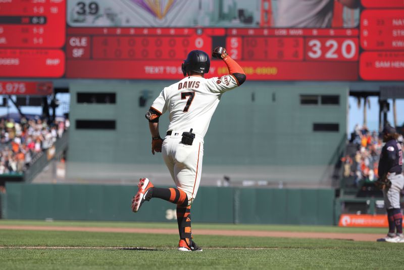 Sep 13, 2023; San Francisco, California, USA; San Francisco Giants third baseman J.D. Davis (7) hits a three run home run during the eighth inning against the Cleveland Guardians at Oracle Park. Mandatory Credit: Sergio Estrada-USA TODAY Sports