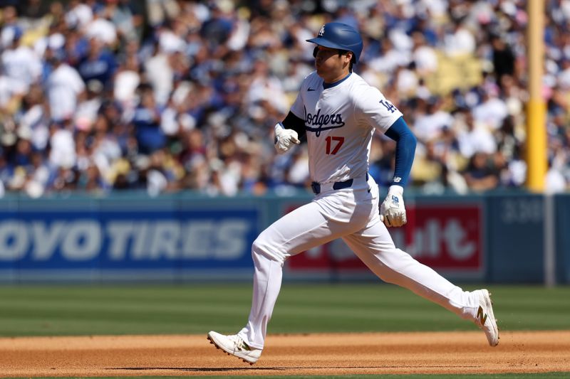 Sep 22, 2024; Los Angeles, California, USA;  Los Angeles Dodgers designated hitter Shohei Ohtani (17) steals second base during the third inning against the Colorado Rockies at Dodger Stadium. Mandatory Credit: Kiyoshi Mio-Imagn Images