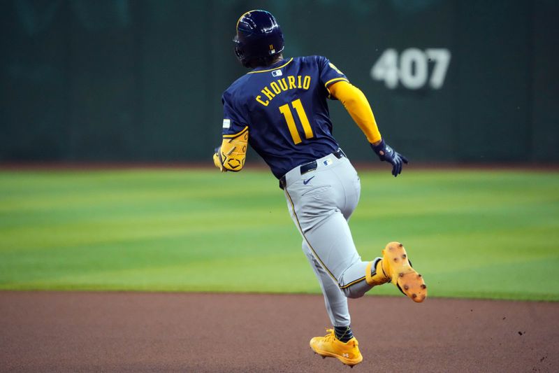 Sep 13, 2024; Phoenix, Arizona, USA; Milwaukee Brewers outfielder Jackson Chourio (11) runs to second base en route to a double against the Arizona Diamondbacks during the first inning at Chase Field. Mandatory Credit: Joe Camporeale-Imagn Images