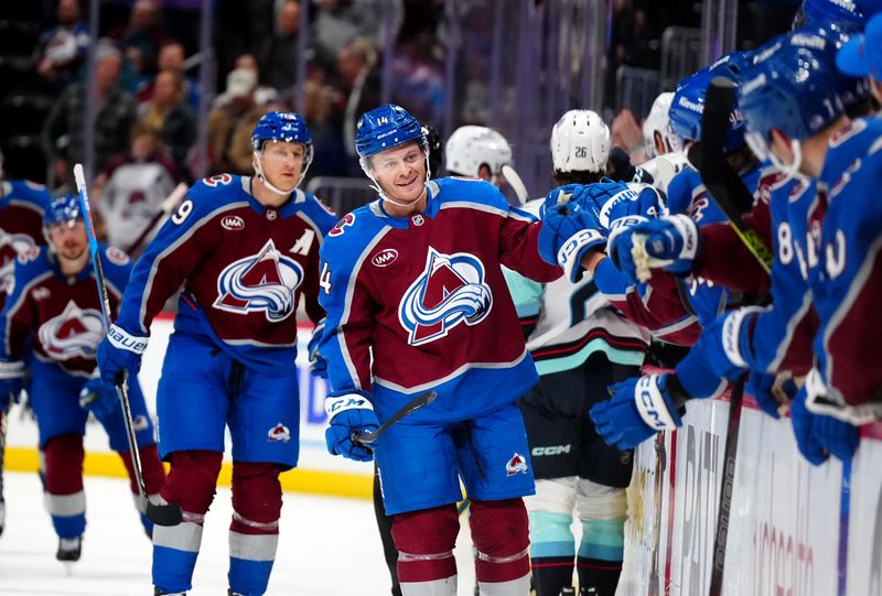 Nov 5, 2024; Denver, Colorado, USA; Colorado Avalanche right wing Chris Wagner (14) celebrates his goal scored with teammates in the first period against the Seattle Kraken at Ball Arena. Mandatory Credit: Ron Chenoy-Imagn Images