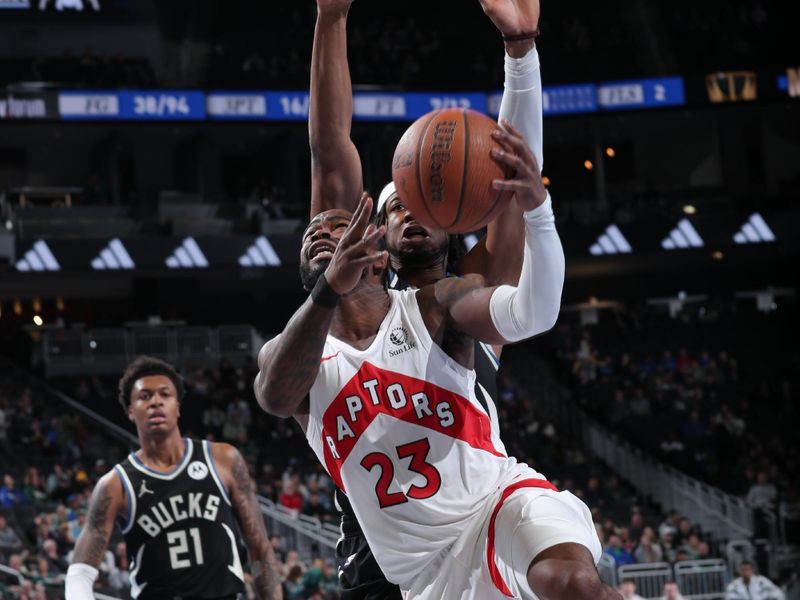 MILWAUKEE, WI - NOVEMBER 12: Jamal Shead #23 of the Toronto Raptors shoots the ball during the game against the Milwaukee Bucks  during the Emirates NBA Cup game on November 12, 2024 at Fiserv Forum Center in Milwaukee, Wisconsin. NOTE TO USER: User expressly acknowledges and agrees that, by downloading and or using this Photograph, user is consenting to the terms and conditions of the Getty Images License Agreement. Mandatory Copyright Notice: Copyright 2024 NBAE (Photo by Gary Dineen/NBAE via Getty Images).