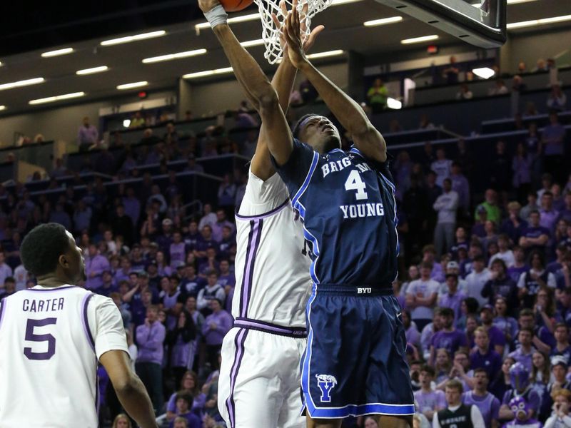 Feb 24, 2024; Manhattan, Kansas, USA; Brigham Young Cougars forward Atiki Ally Atiki (4) makes a layup against Kansas State Wildcats center Will McNair Jr. (13) during the second half at Bramlage Coliseum. Mandatory Credit: Scott Sewell-USA TODAY Sports