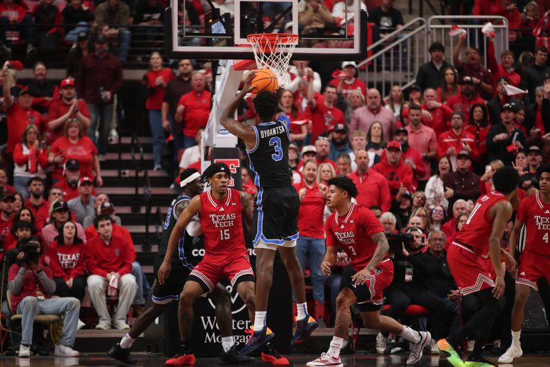 Jan 17, 2026; Lubbock, Texas, USA;  BYU Cougars forward AJ Dybantsa (3) takes a jump shot against Texas Tech Red Raiders forward JT Toppin (15) in the first half at United Supermarkets Arena. Mandatory Credit: Michael C. Johnson-Imagn Images
