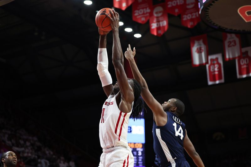 Jan 31, 2024; Piscataway, New Jersey, USA; Rutgers Scarlet Knights center Clifford Omoruyi (11) rebounds against Penn State Nittany Lions forward Demetrius Lilley (14) during the first half at Jersey Mike's Arena. Mandatory Credit: Vincent Carchietta-USA TODAY Sports