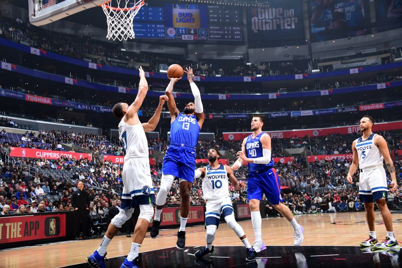 LOS ANGELES, CA - FEBRUARY 28: Paul George #13 of the LA Clippers shoots the ball during the game against the Minnesota Timberwolves on February 28, 2023 at Crypto.Com Arena in Los Angeles, California. NOTE TO USER: User expressly acknowledges and agrees that, by downloading and/or using this Photograph, user is consenting to the terms and conditions of the Getty Images License Agreement. Mandatory Copyright Notice: Copyright 2023 NBAE (Photo by Adam Pantozzi/NBAE via Getty Images)