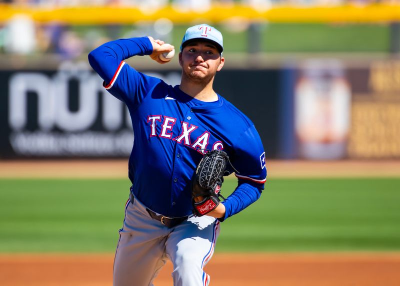 Mar 5, 2024; Peoria, Arizona, USA; Texas Rangers pitcher Owen White against the Seattle Mariners during a spring training baseball game at Peoria Sports Complex. Mandatory Credit: Mark J. Rebilas-USA TODAY Sports