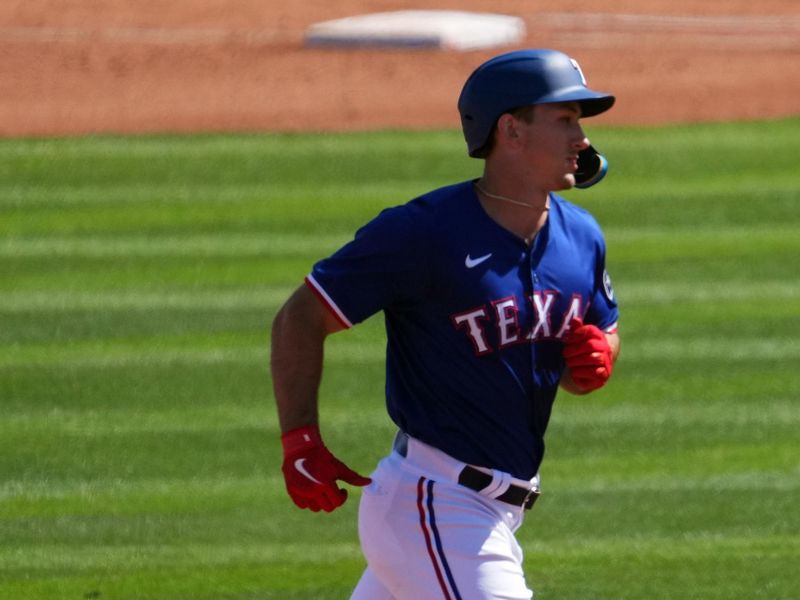 Mar 8, 2024; Surprise, Arizona, USA; Texas Rangers left fielder Wyatt Langford (82) runs the bases after hitting a solo home run against the Kansas City Royals during the fourth inning at Surprise Stadium. Mandatory Credit: Joe Camporeale-USA TODAY Sports