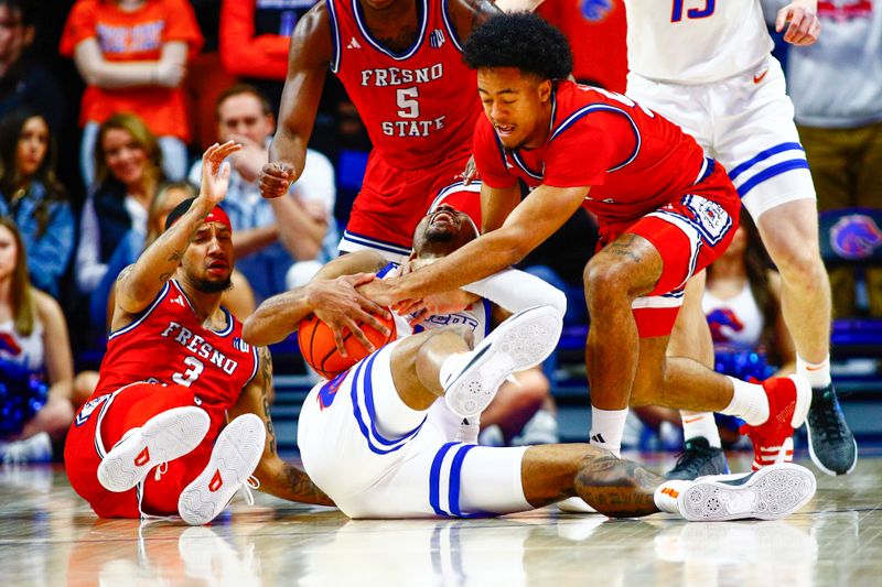 Feb 17, 2024; Boise, Idaho, USA; Boise State Broncos guard Chibuzo Agbo (11) reacts to Fresno State Bulldogs guard Xavier DuSell (53) attempting to steal the ball during the first half at ExtraMile Arena. Mandatory Credit: Brian Losness-USA TODAY Sports

