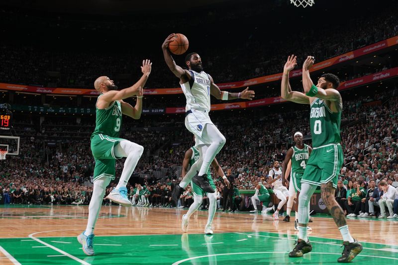 BOSTON, MA - JUNE 17: Kyrie Irving #11 of the Dallas Mavericks drives to the basket during the game against the Boston Celtics during Game 5 of the 2024 NBA Finals on June 17, 2024 at the TD Garden in Boston, Massachusetts. NOTE TO USER: User expressly acknowledges and agrees that, by downloading and or using this photograph, User is consenting to the terms and conditions of the Getty Images License Agreement. Mandatory Copyright Notice: Copyright 2024 NBAE  (Photo by Jesse D. Garrabrant/NBAE via Getty Images)