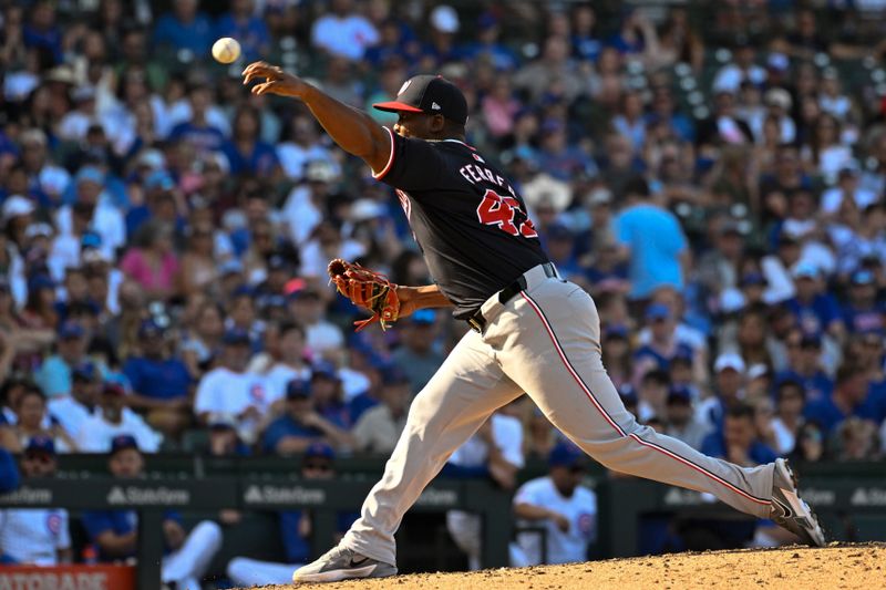 Sep 21, 2024; Chicago, Illinois, USA;  Washington Nationals pitcher Jose A. Ferrer (47) delivers against the Chicago Cubs during the eighth inning at Wrigley Field. Mandatory Credit: Matt Marton-Imagn Images