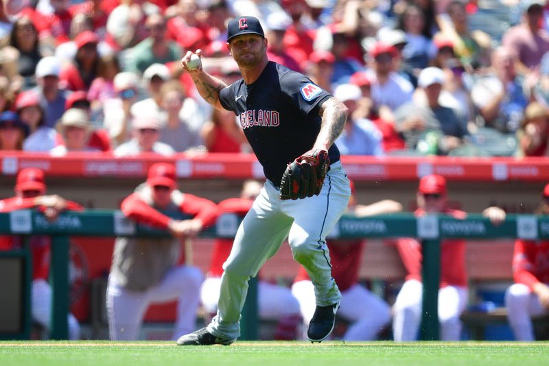 May 26, 2024; Anaheim, California, USA; Cleveland Guardians pitcher Ben Lively (39) is late on the throw to first for the out against Los Angeles Angels shortstop Zach Neto (9) during the fifth inning at Angel Stadium. Mandatory Credit: Gary A. Vasquez-USA TODAY Sports