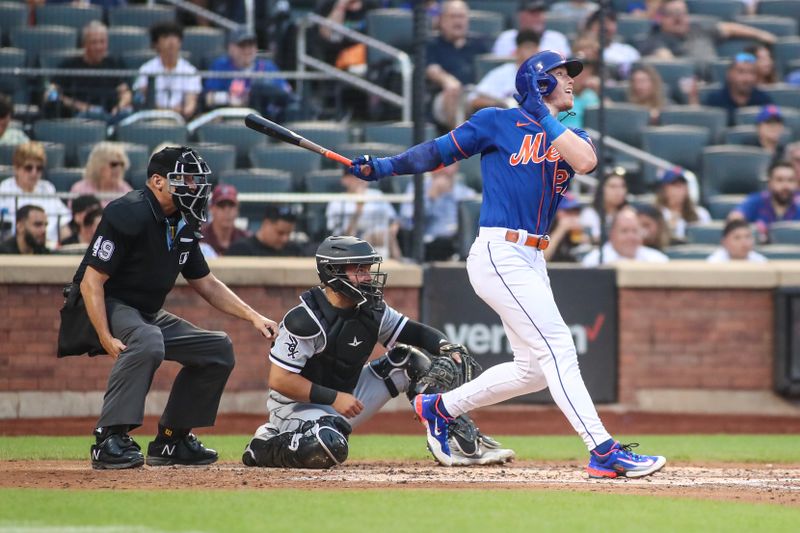 Jul 19, 2023; New York City, New York, USA;  New York Mets third baseman Brett Baty (22) hits a solo home run in the third inning against the Chicago White Sox at Citi Field. Mandatory Credit: Wendell Cruz-USA TODAY Sports