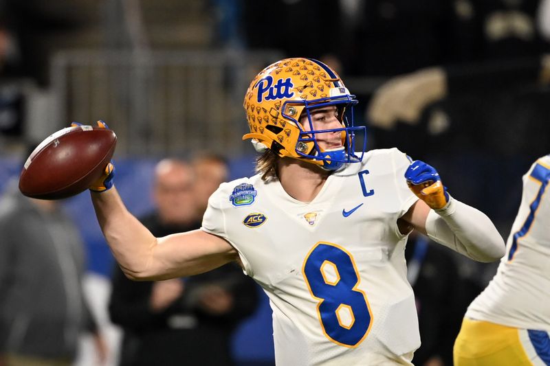 Dec 4, 2021; Charlotte, NC, USA; Pittsburgh Panthers quarterback Kenny Pickett (8) looks to pass in the first quarter of the ACC championship game at Bank of America Stadium. Mandatory Credit: Bob Donnan-USA TODAY Sports