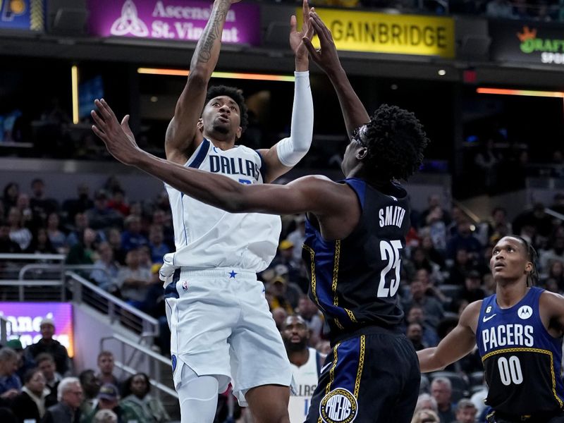 INDIANAPOLIS, INDIANA - MARCH 27: Christian Wood #35 of the Dallas Mavericks attempts a shot while being guarded by Jalen Smith #25 of the Indiana Pacers in the third quarter at Gainbridge Fieldhouse on March 27, 2023 in Indianapolis, Indiana. NOTE TO USER: User expressly acknowledges and agrees that, by downloading and or using this photograph, User is consenting to the terms and conditions of the Getty Images License Agreement. (Photo by Dylan Buell/Getty Images)