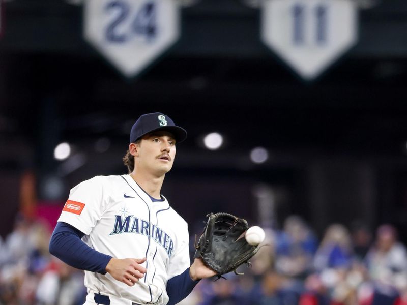 May 31, 2025; Seattle, Washington, USA; Seattle Mariners second baseman Cole Young (2) warms up in the outfield before the first inning against the Minnesota Twins at T-Mobile Park. Mandatory Credit: Joe Nicholson-Imagn Images