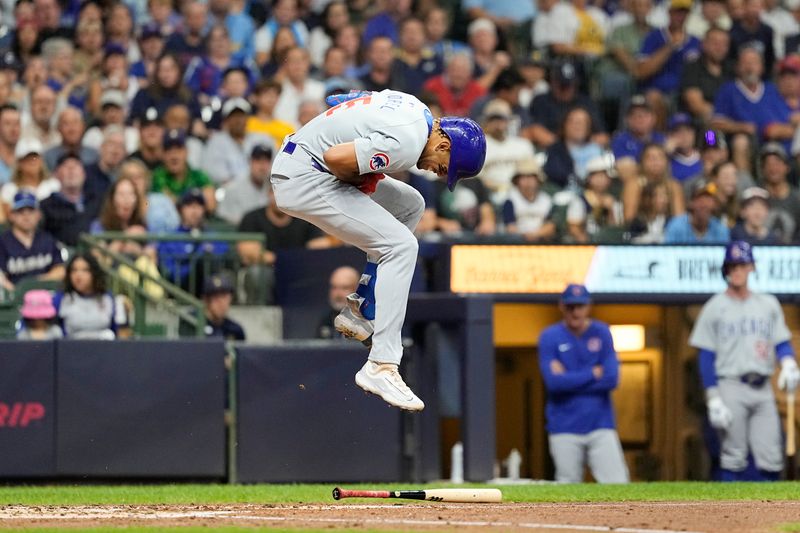 Jun 28, 2024; Milwaukee, Wisconsin, USA;  Chicago Cubs third baseman Christopher Morel (5) reacts after being hit by a pitch during the fourth inning against the Milwaukee Brewers at American Family Field. Mandatory Credit: Jeff Hanisch-USA TODAY Sports