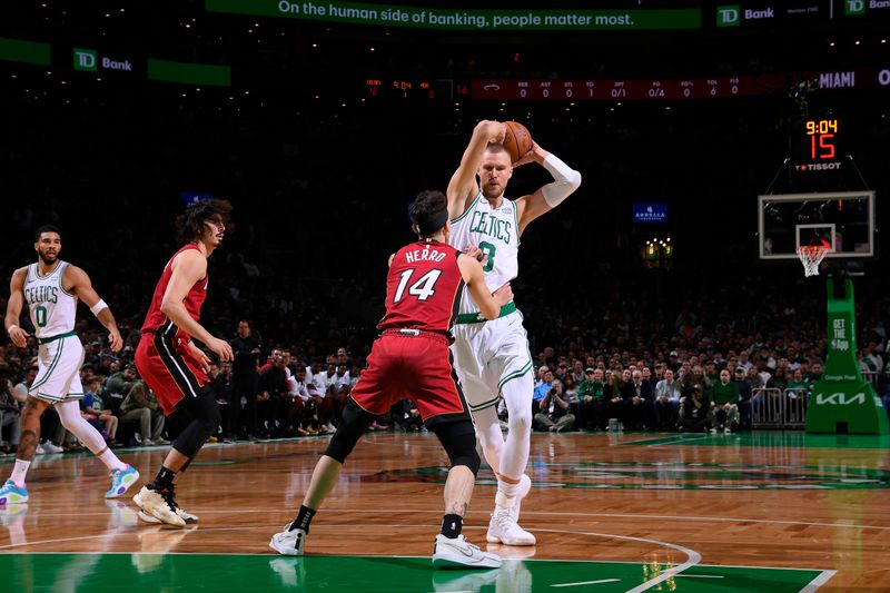 BOSTON, MA - APRIL 21: Kristaps Porzingis #8 of the Boston Celtics handles the ball during the game against the Miami Heat during Round 1 Game 1 of the 2024 NBA Playoffs on April 21, 2024 at the TD Garden in Boston, Massachusetts. NOTE TO USER: User expressly acknowledges and agrees that, by downloading and or using this photograph, User is consenting to the terms and conditions of the Getty Images License Agreement. Mandatory Copyright Notice: Copyright 2024 NBAE  (Photo by Brian Babineau/NBAE via Getty Images)