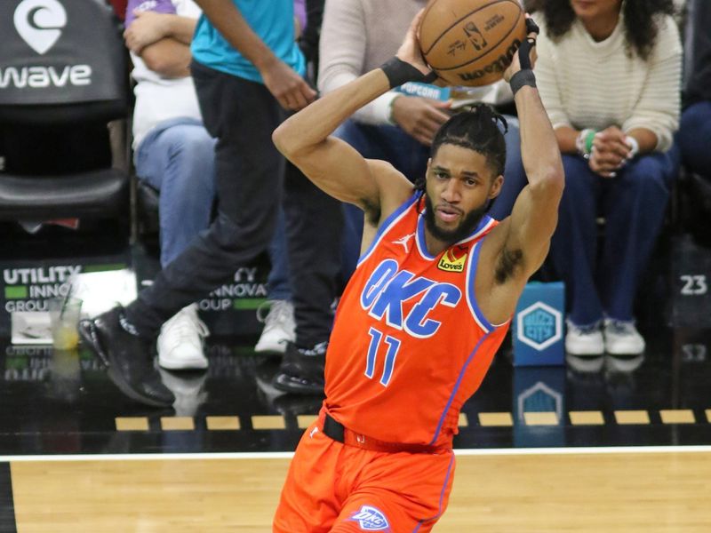 CHARLOTTE, NC - APRIL 7: Isaiah Joe #11 of the Oklahoma City Thunder passes the ball during the game against the Charlotte Hornets on April 7, 2024 at Spectrum Center in Charlotte, North Carolina. NOTE TO USER: User expressly acknowledges and agrees that, by downloading and or using this photograph, User is consenting to the terms and conditions of the Getty Images License Agreement.  Mandatory Copyright Notice:  Copyright 2024 NBAE (Photo by Brock Williams-Smith/NBAE via Getty Images)