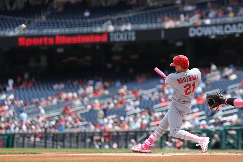 May 11, 2025; Washington, District of Columbia, USA; St. Louis Cardinals outfielder Lars Nootbaar (21) hits a solo home run against the Washington Nationals during the first inning at Nationals Park. Mandatory Credit: Geoff Burke-Imagn Images
