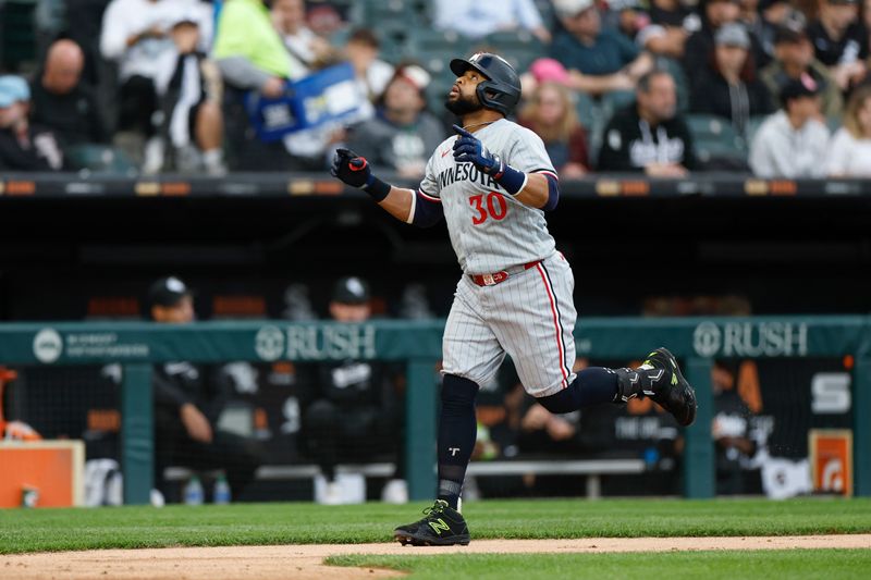 Apr 29, 2024; Chicago, Illinois, USA; Minnesota Twins first baseman Carlos Santana (30) rounds the bases after hitting a two-run home run against the Chicago White Sox during the second inning at Guaranteed Rate Field. Mandatory Credit: Kamil Krzaczynski-USA TODAY Sports