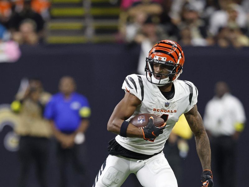 Cincinnati Bengals wide receiver Ja'Marr Chase (1) runs the ball during an NFL football game against the New Orleans Saints, Sunday, Oct. 16, 2022, in New Orleans. (AP Photo/Tyler Kaufman)