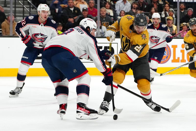 Mar 23, 2024; Las Vegas, Nevada, USA; Columbus Blue Jackets defenseman Ivan Provorov (9) breaks up a shot attempt by Vegas Golden Knights center Brett Howden (21) during the second period at T-Mobile Arena. Mandatory Credit: Stephen R. Sylvanie-USA TODAY Sports