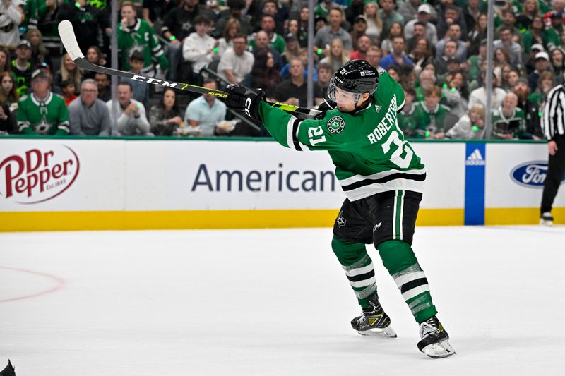 May 1, 2024; Dallas, Texas, USA; Dallas Stars left wing Jason Robertson (21) scores a goal on a power play against the Vegas Golden Knights during the second period in game five of the first round of the 2024 Stanley Cup Playoffs at the American Airlines Center. Mandatory Credit: Jerome Miron-USA TODAY Sports