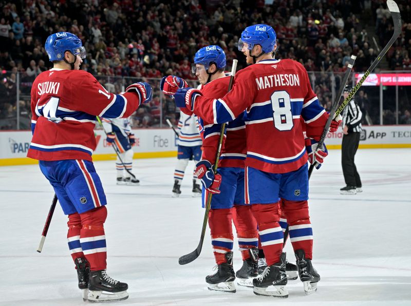 Nov 18, 2024; Montreal, Quebec, CAN; Montreal Canadiens forward Brendan Gallagher (11) celebrates with teammates forward Nick Suzuki (14) and defenseman Mike Matheson (8) after scoring a goal against the Edmonton Oilers during the second period at the Bell Centre. Mandatory Credit: Eric Bolte-Imagn Images