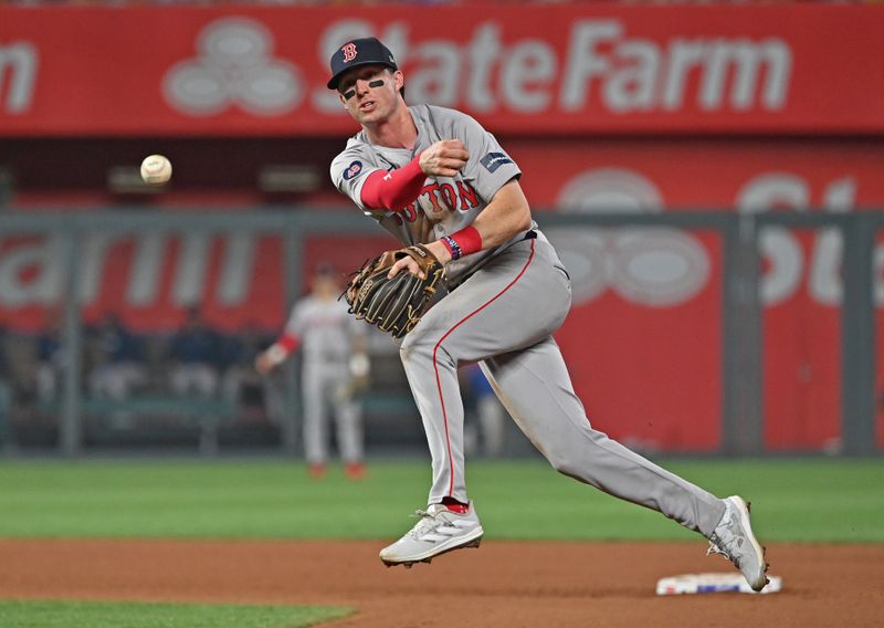 Aug 5, 2024; Kansas City, Missouri, USA;  Boston Red Sox second baseman Nick Sogard (75) throws to first base for an out in the ninth inning against the Kansas City Royals at Kauffman Stadium. Mandatory Credit: Peter Aiken-USA TODAY Sports