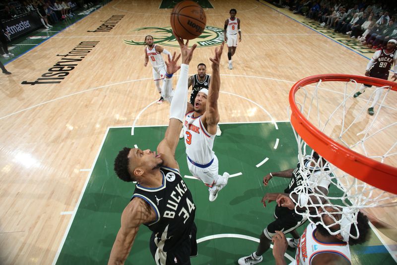 MILWAUKEE, WI - APRIL 7: Giannis Antetokounmpo #34 of the Milwaukee Bucks and Josh Hart #3 of the New York Knicks go up for the rebound during the game on April 7, 2024 at the Fiserv Forum Center in Milwaukee, Wisconsin. NOTE TO USER: User expressly acknowledges and agrees that, by downloading and or using this Photograph, user is consenting to the terms and conditions of the Getty Images License Agreement. Mandatory Copyright Notice: Copyright 2024 NBAE (Photo by Gary Dineen/NBAE via Getty Images).