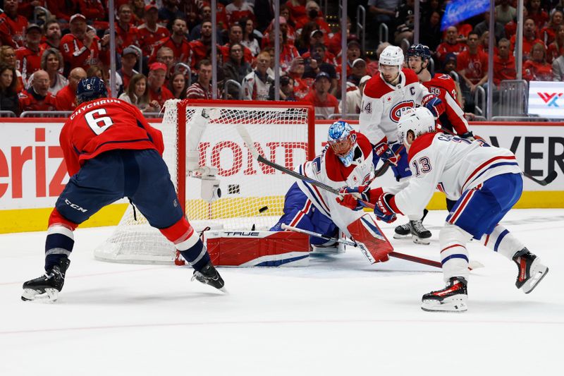 Apr 30, 2025; Washington, District of Columbia, USA; Washington Capitals defenseman Jakob Chychrun (6) scores a goal on Montreal Canadiens goaltender Jakub Dobes (75) in the first period in game five of the first round of the 2025 Stanley Cup Playoffs at Capital One Arena. Mandatory Credit: Geoff Burke-Imagn Images