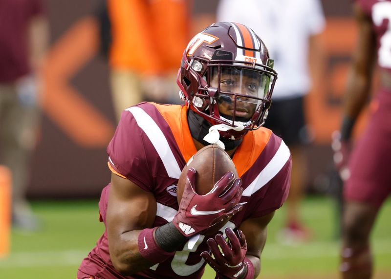 Oct 9, 2021; Blacksburg, Virginia, USA;  Virginia Tech Hokies defensive back DJ Harvey (20) catches a punt before the game against the Notre Dame Fighting Irish at Lane Stadium. Mandatory Credit: Reinhold Matay-USA TODAY Sports