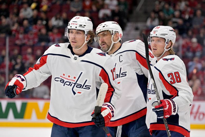 Apr 6, 2023; Montreal, Quebec, CAN; Washington Capitals forward Dylan Strome (17) celebrates with teammates forward Alex Ovechkin (8) and defenseman Rasmus Sandin (38) after scoring a goal against the Montreal Canadiens during the first period at the Bell Centre. Mandatory Credit: Eric Bolte-USA TODAY Sports