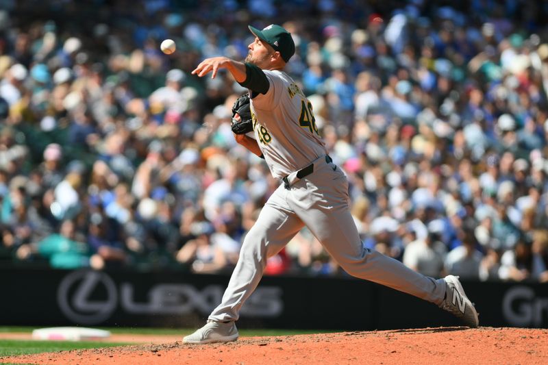 May 12, 2024; Seattle, Washington, USA; Oakland Athletics relief pitcher T.J. McFarland (48) pitches to the Seattle Mariners during the eighth inning at T-Mobile Park. Mandatory Credit: Steven Bisig-USA TODAY Sports