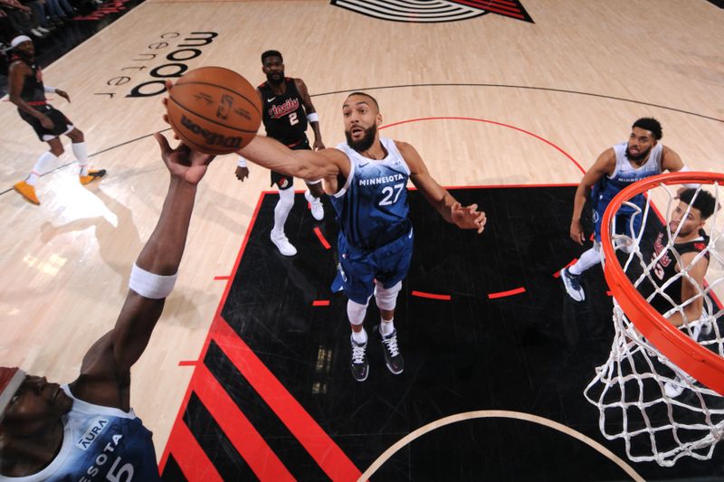 PORTLAND, OR - FEBRUARY 15: Rudy Gobert #27 of the Minnesota Timberwolves goes up for the rebound during the game against the Portland Trail Blazers on February 15, 2024 at the Moda Center Arena in Portland, Oregon. NOTE TO USER: User expressly acknowledges and agrees that, by downloading and or using this photograph, user is consenting to the terms and conditions of the Getty Images License Agreement. Mandatory Copyright Notice: Copyright 2024 NBAE (Photo by Cameron Browne/NBAE via Getty Images)