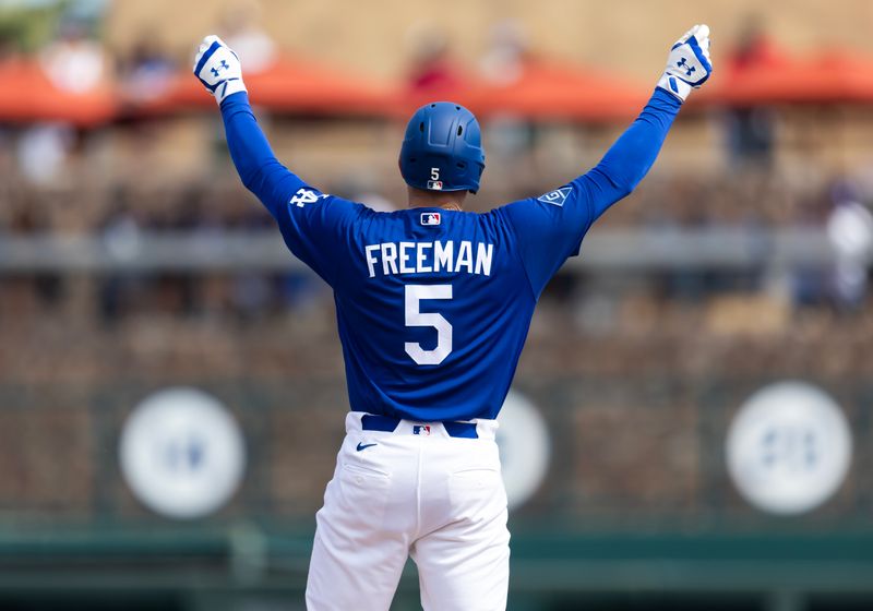 Mar 1, 2026; Phoenix, Arizona, USA; Detailed view of the jersey of Los Angeles Dodgers first baseman Freddie Freeman (5) as he celebrates after hitting a double against the Los Angeles Angels during a spring training game at Camelback Ranch-Glendale. Mandatory Credit: Mark J. Rebilas-Imagn Images
