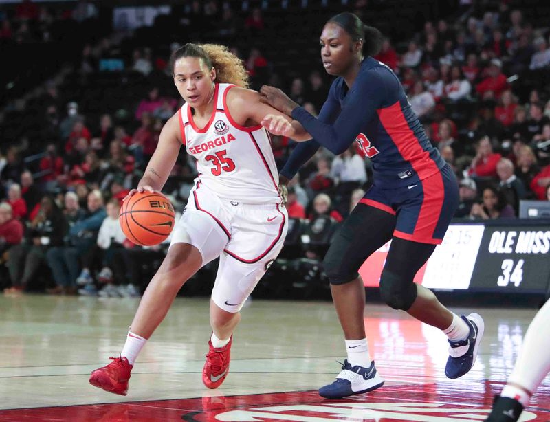 Jan 21, 2024; Athens, Georgia, USA; Georgia Bulldogs forward Javyn Nicholson (35) dribbles against Ole Miss Rebels forward Tyia Singleton (22) during the first half at Stegeman Coliseum. Mandatory Credit: Mady Mertens-USA TODAY Sports