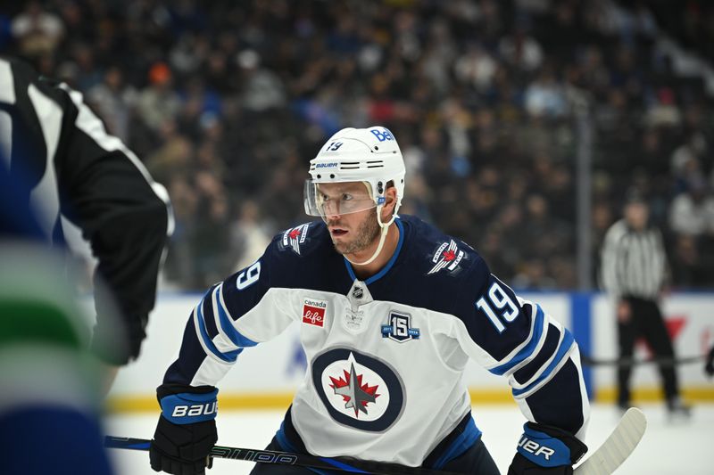 Feb 25, 2026; Vancouver, British Columbia, CAN;  Winnipeg Jets center Jonathan Toews (19) awaits the faceoff during the third period against the Vancouver Canucks at Rogers Arena. Mandatory Credit: Simon Fearn-Imagn Images