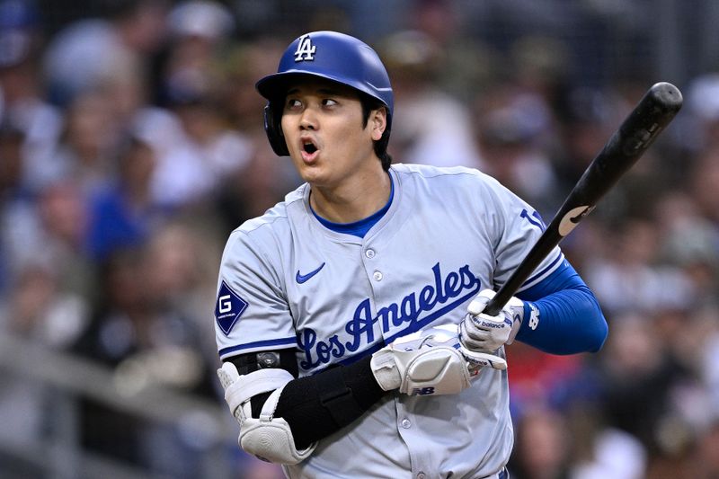 May 11, 2024; San Diego, California, USA; Los Angeles Dodgers designated hitter Shohei Ohtani (17) reacts after a walk during the sixth inning against the San Diego Padres at Petco Park. Mandatory Credit: Orlando Ramirez-USA TODAY Sports